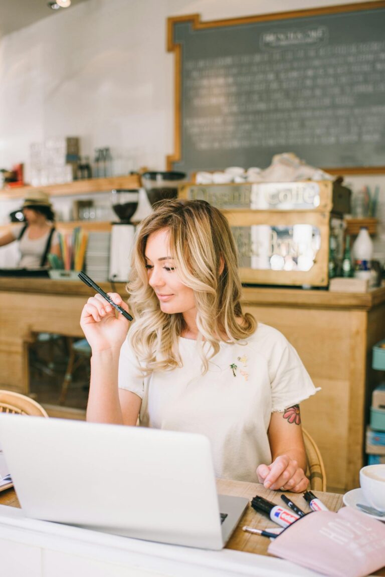 Woman Working Inside the Coffee Shop